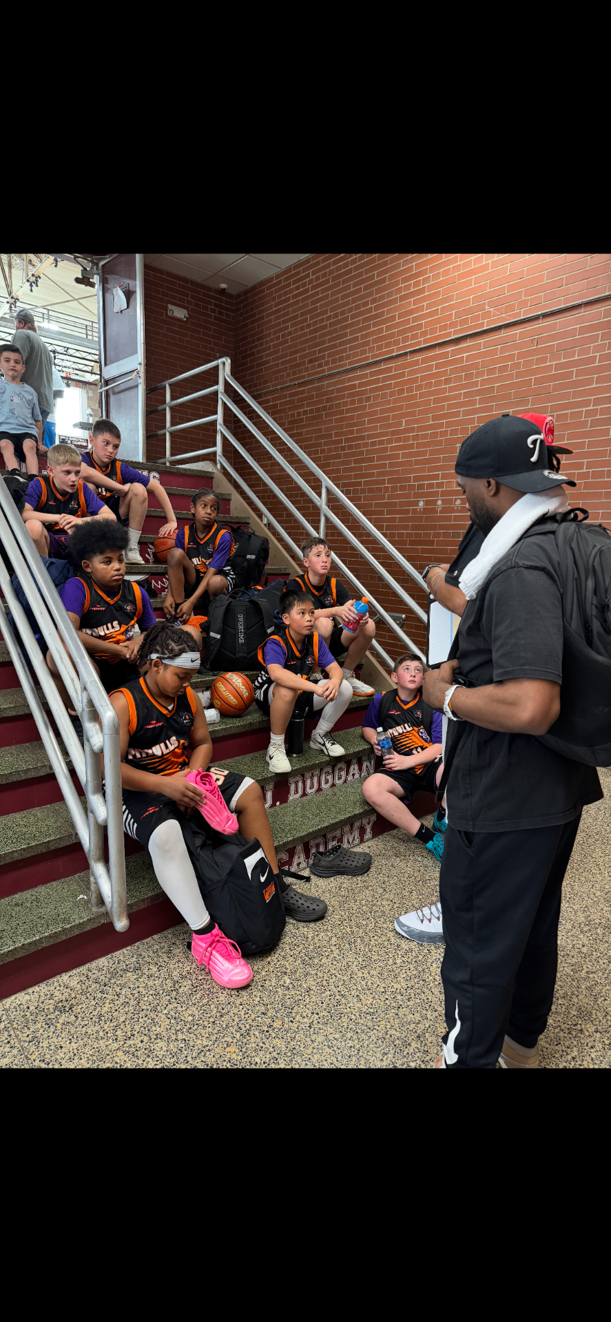 LI Legacy coach speaking with players