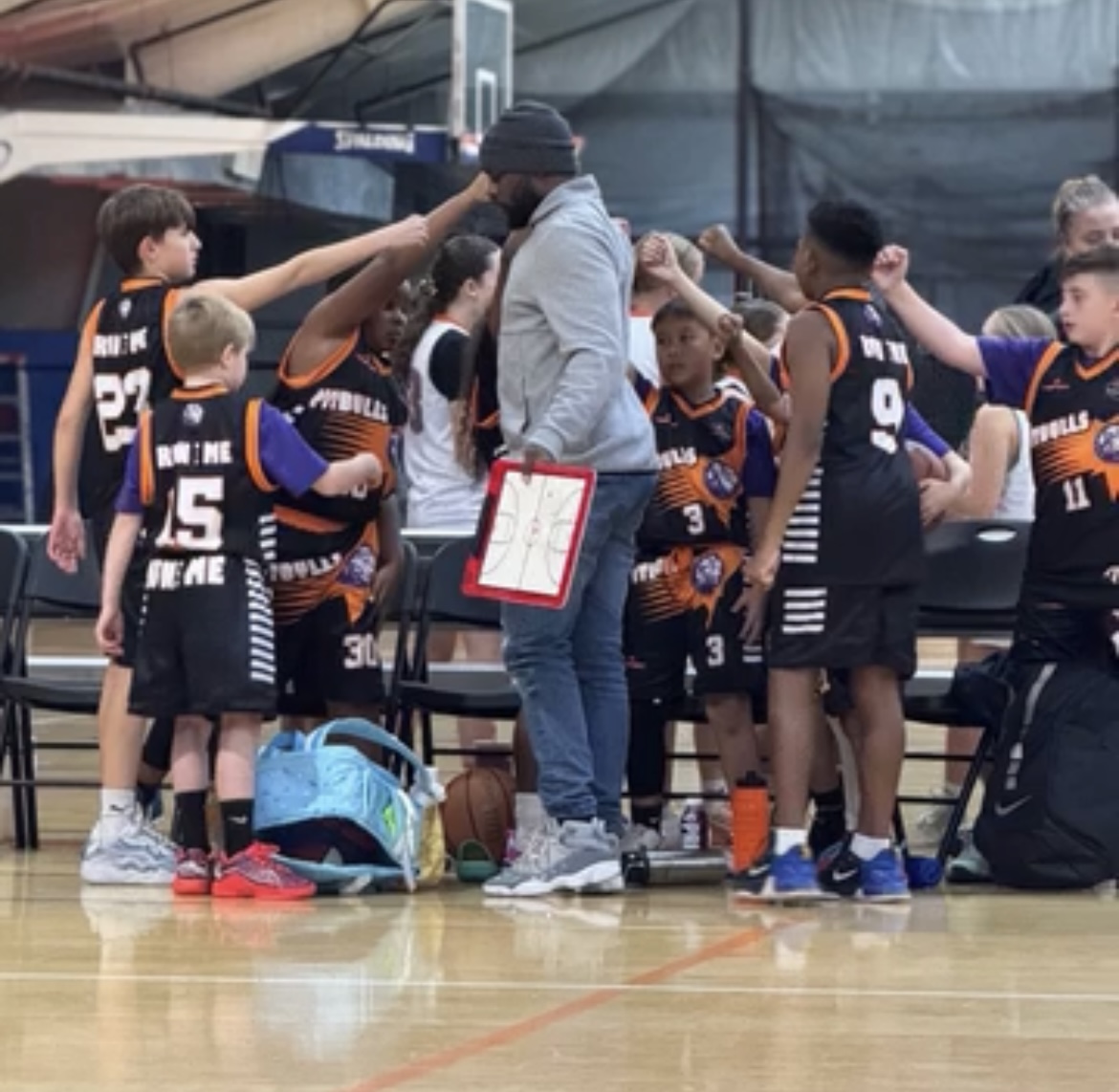 LI Legacy team huddle with coach